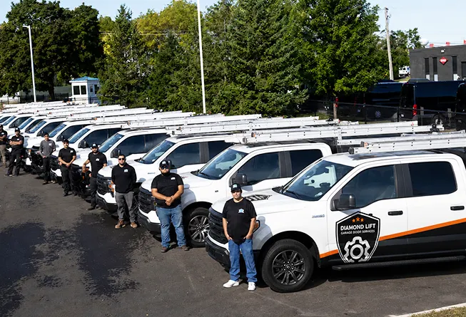 DiamondLift Garage Doors service trucks and technician crew lined up in Milwaukee